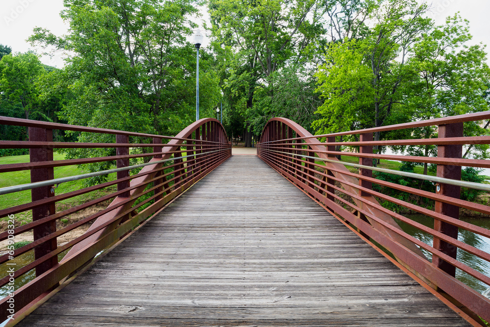 Walking bridge in park on riverfront in Columbus, Georgia