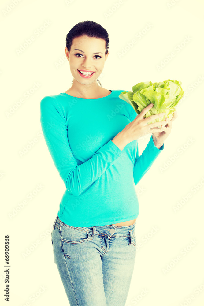 Attractive smiling woman with fresh salat Attractive smiling woman with fresh salat