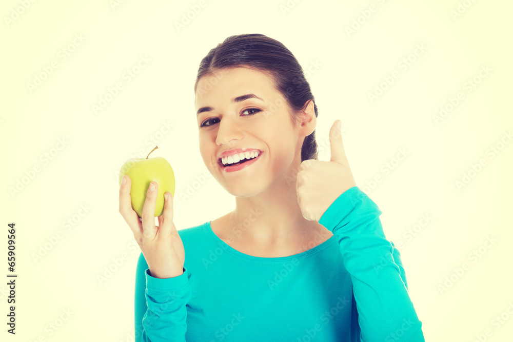 Woman showing ok with apple. Woman showing ok with apple.