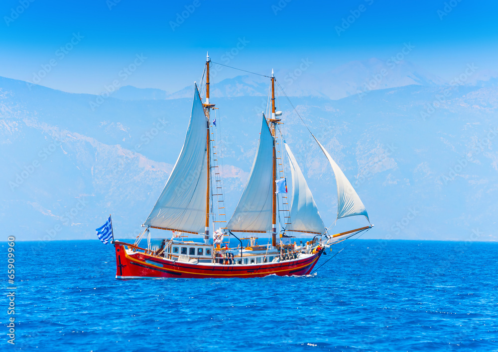 Classic wooden Greek boat (Perama) in Spetses island in Greece Classic wooden Greek boat (Perama) in Spetses island in Greece