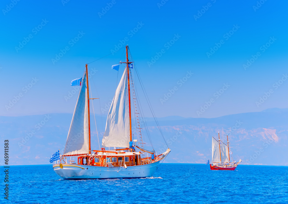 2 Old classic wooden sailing boats in Spetses island in Greece