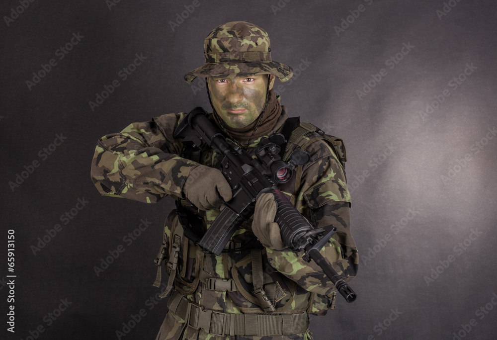 Soldier in camouflage and modern weapon M4. Soldier in camouflage and modern weapon M4.