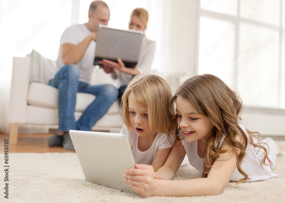 smiling sister with tablet pc and parents on back smiling sister with tablet pc and parents on back