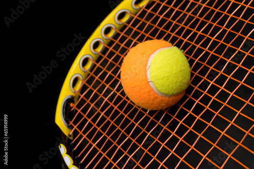 Tennis ball for kids with tennis racket © Itan1409