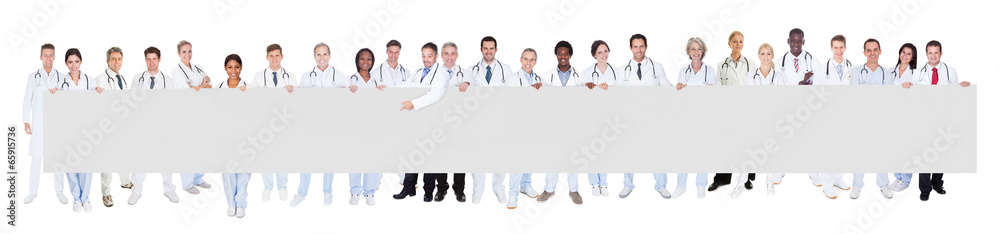 Multiethnic Doctors Holding Blank Banner Multiethnic Doctors Holding Blank Banner