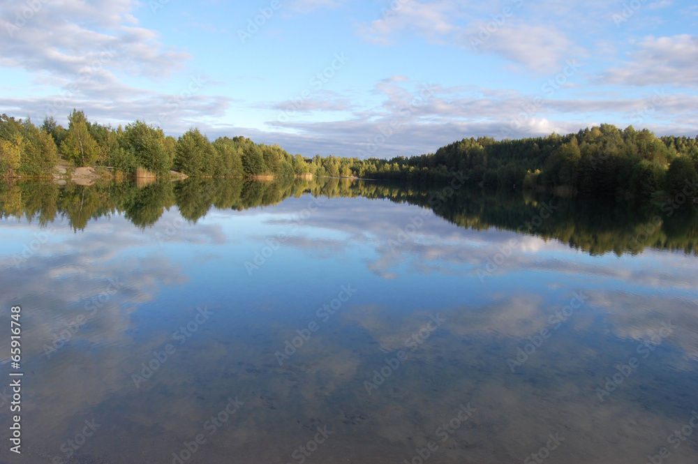 The perfect mirror reflection - lake, Stockholm, Sweden The perfect mirror reflection - lake, Stockholm, Sweden