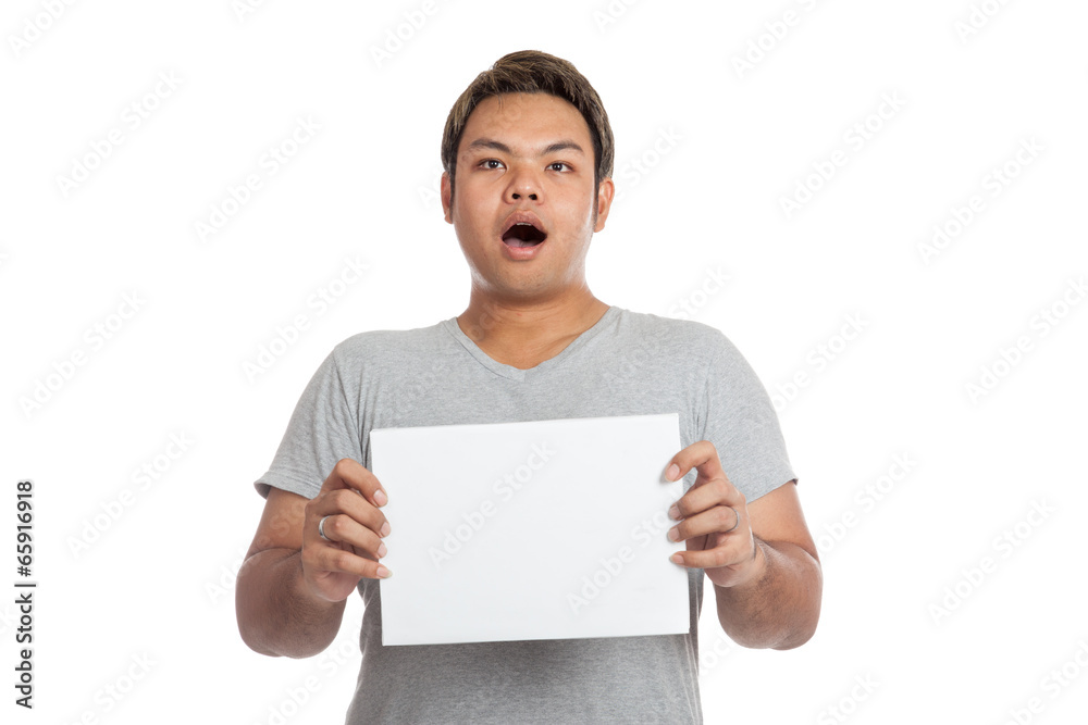 Asian strong man shocked, surprised, with blank sign Asian strong man shocked, surprised, with blank sign