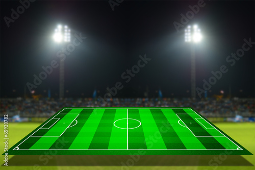 simulation of football field with stadium background