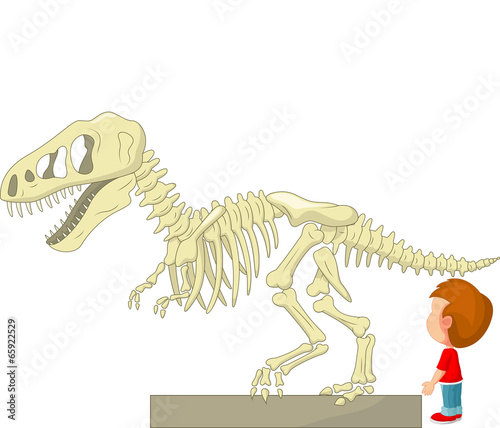 Boy with dinosaur skeleton at the museum