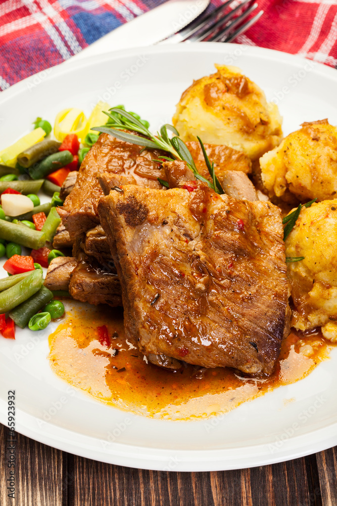 Pork spareribs served with mashed potatoes