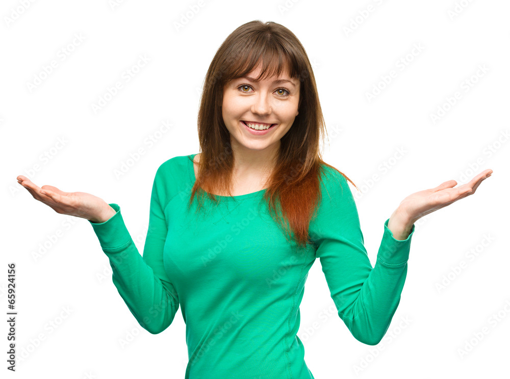 Portrait of a young woman raised her hands up