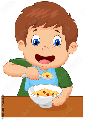 Boy is having cereal for breakfast