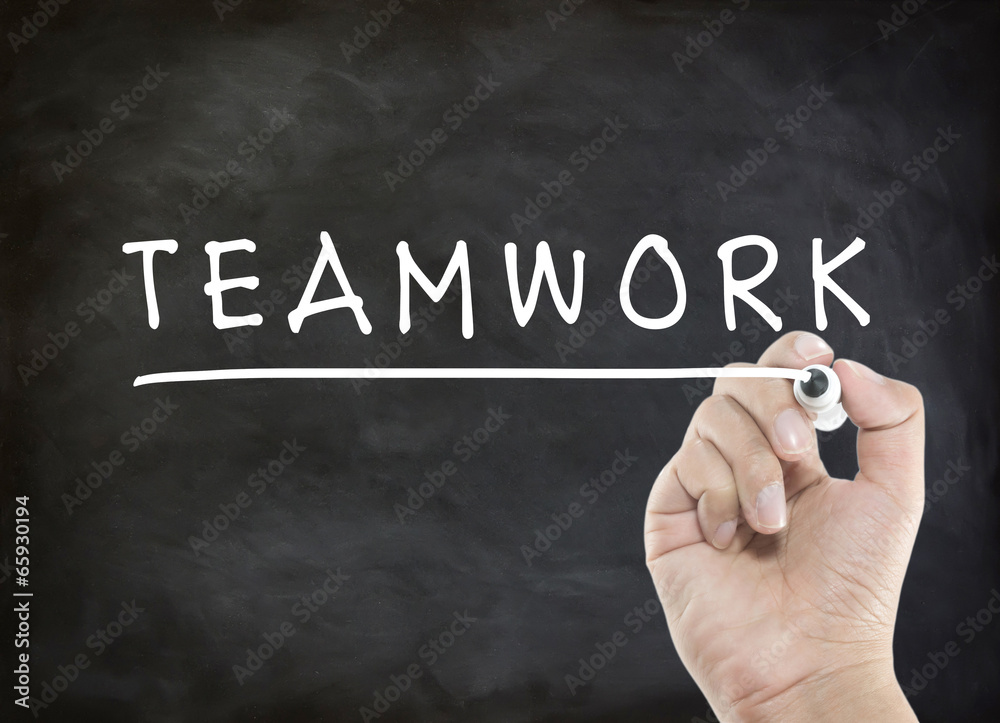 Fototapeta premium Teamwork with hand writing