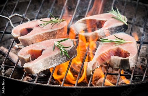 Grilled salmon steaks on fire