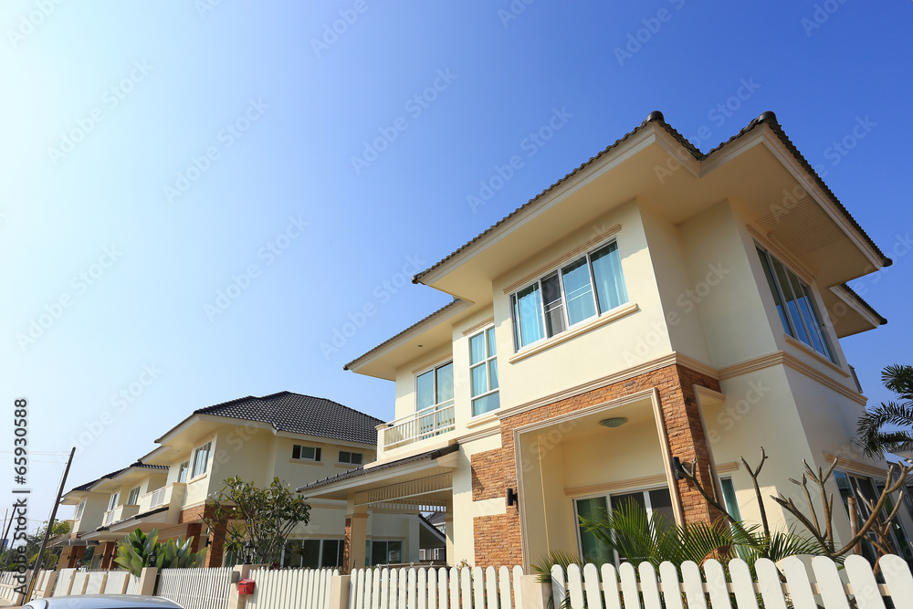 Big house modern style with sunshine and blue sky background