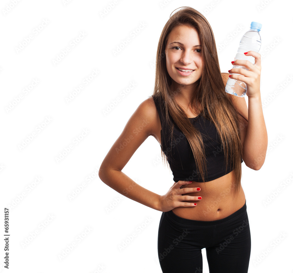 pretty young sporty woman holding a water glass on white backgro pretty young sporty woman holding a water glass on white backgro