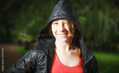 Teenage girl in sports hooded jacket