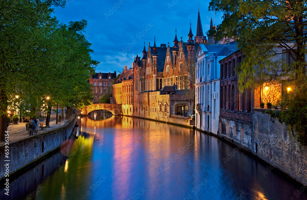 Fototapeta premium Historic medieval buildings along a canal in Bruges, Belgium