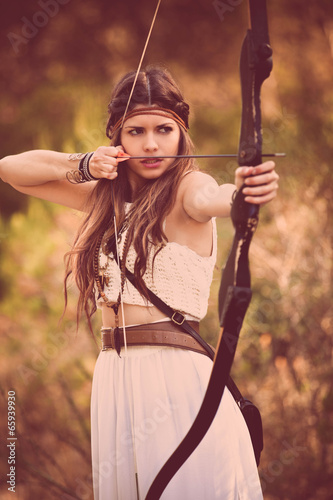 woodland hunter woman with bow and arrow