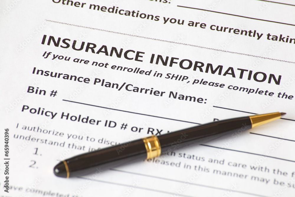 Close - up insurance information with a pen
