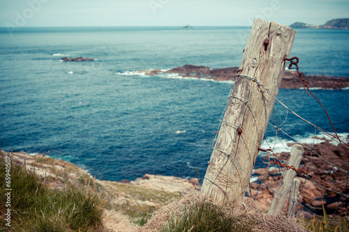 Old fence post by the sea