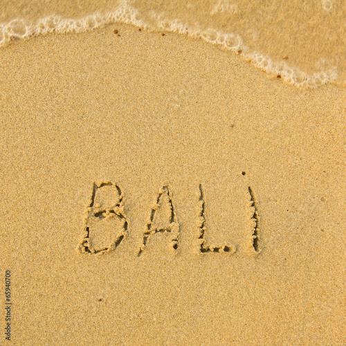 Bali - written in sand on beach texture. © De Visu