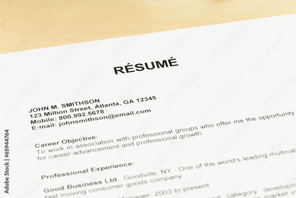 Resume on table closeup job applying concept Resume on table closeup job applying concept