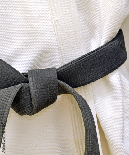 Karate Black Belt on White Uniform photo