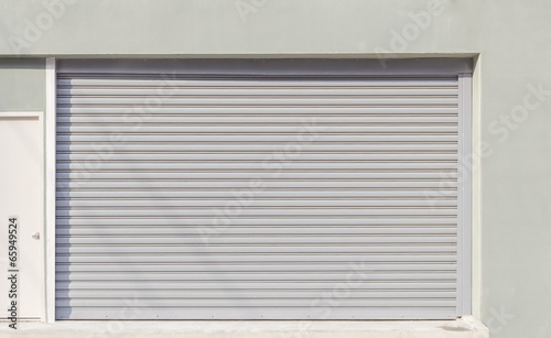 Storefront or shopfront is a facade or entryway of retail store. Protection with security door also called roller door or roller shutter. Motorised type by automatic operation with electrical power.