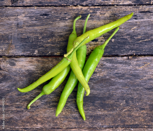 Green pepper on a wooden floor