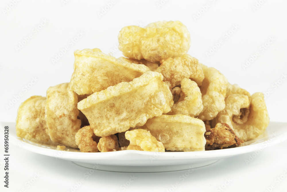 Pork rinds also known as chicharon or chicharrones, deep fried p Pork rinds also known as chicharon or chicharrones, deep fried p