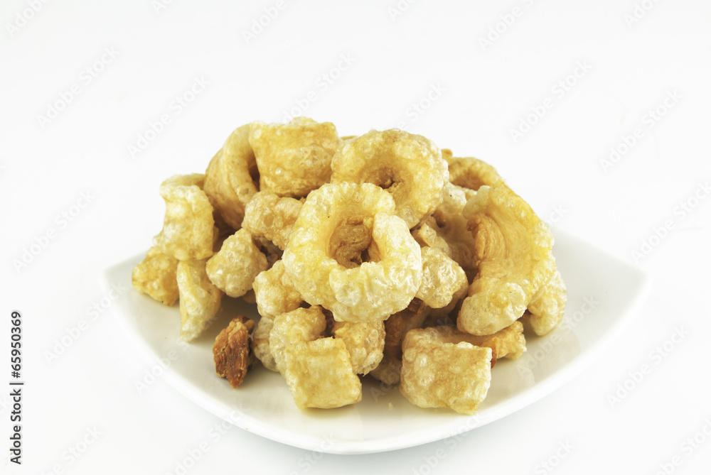 Pork rinds also known as chicharon or chicharrones, deep fried p Pork rinds also known as chicharon or chicharrones, deep fried p