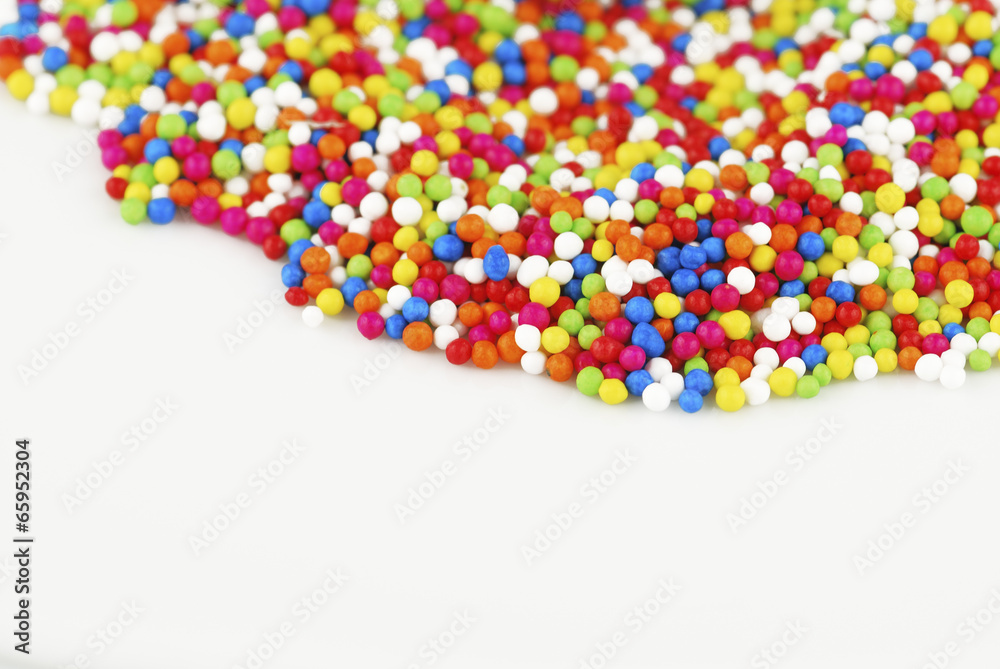 Colorful candy confetti on the white background