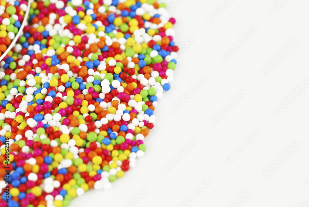 Colorful candy confetti on the white background Colorful candy confetti on the white background