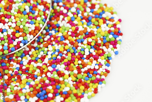 Colorful candy confetti on the white background