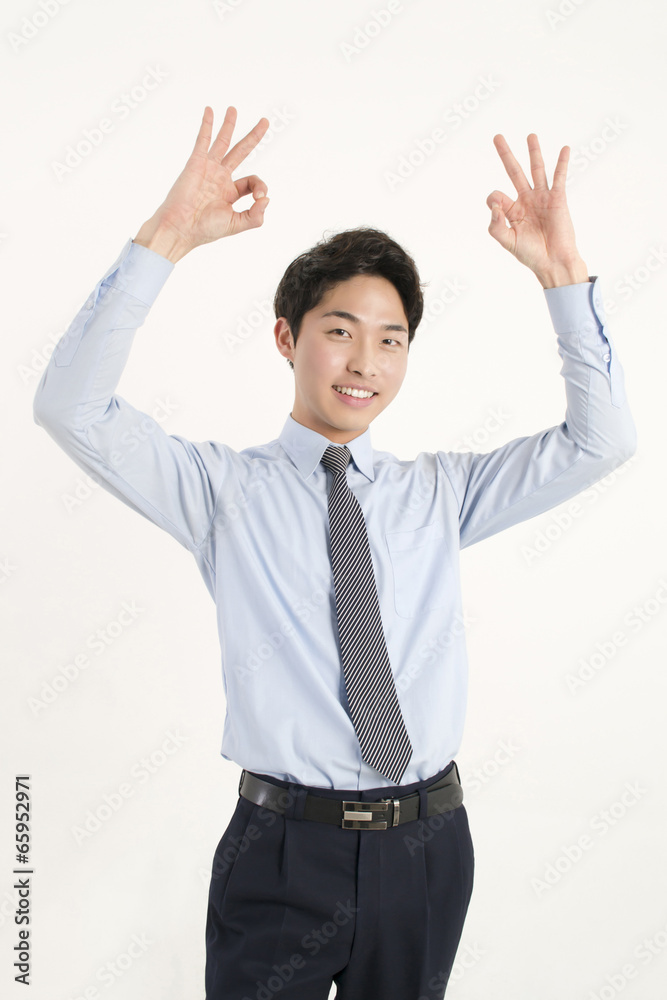 Asian young businessman giving okay sign Asian young businessman giving okay sign