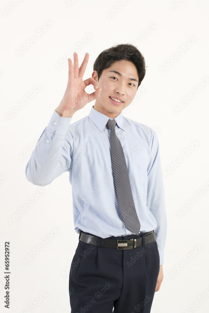 Asian young businessman giving okay sign