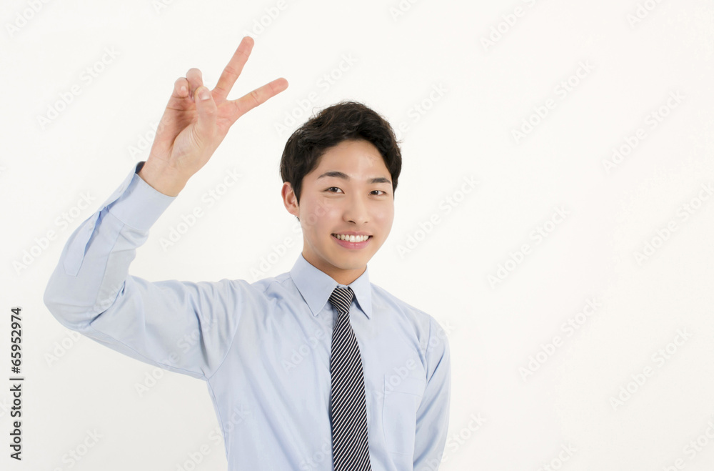 Asian young businessman with two finger peace sign hand gesture Asian young businessman with two finger peace sign hand gesture