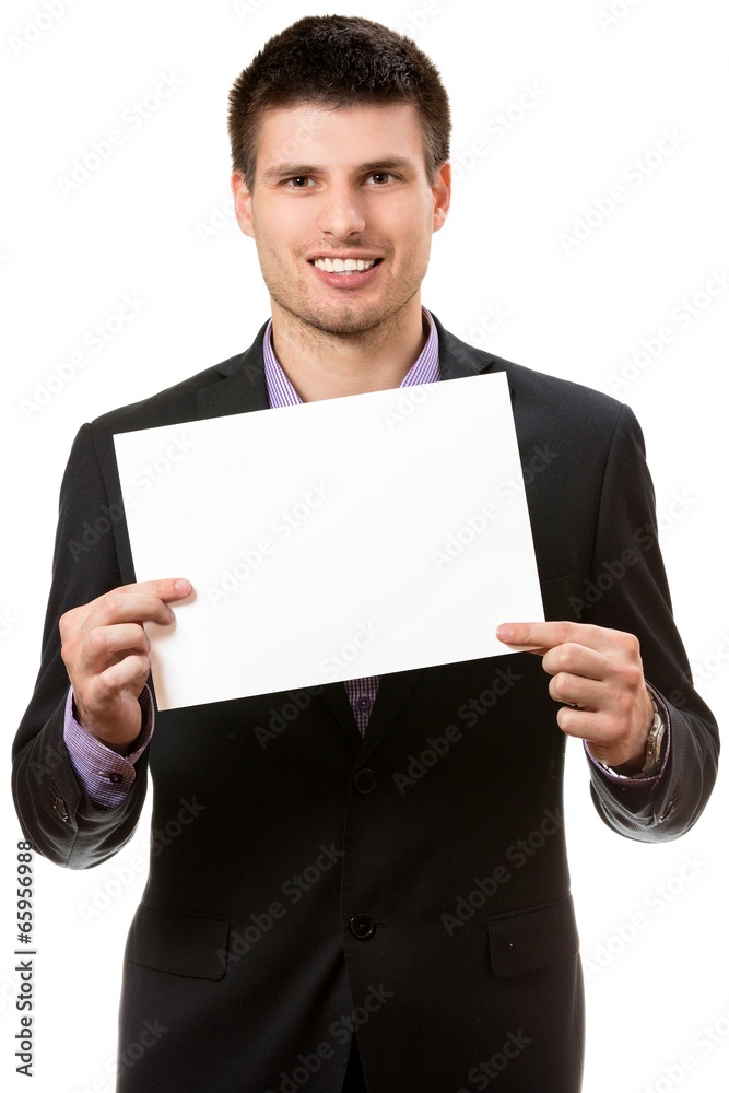 Smiling young business man,showing a white card Smiling young business man,showing a white card