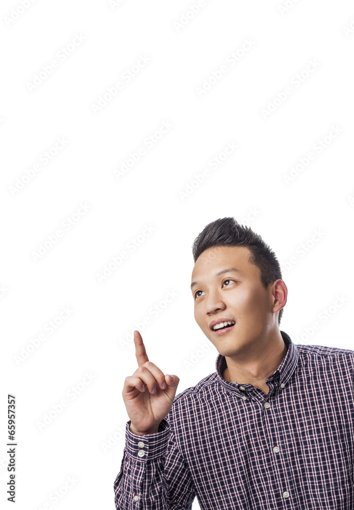 portrait of young asian man pointing up with finger portrait of young asian man pointing up with finger