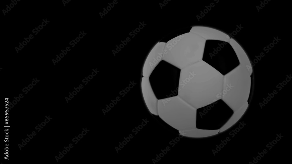 Soccer ball flies at the camera then stops but keeps rotating. Soccer ball flies at the camera then stops but keeps rotating.