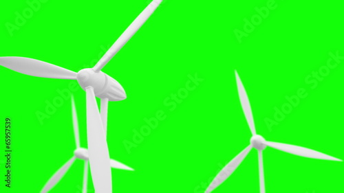 Regular wind turbines rotating. green screen background