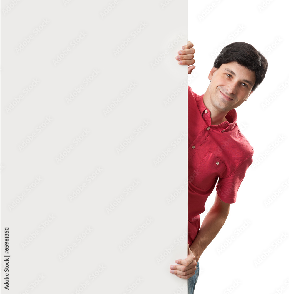 Happy smiling man showing blank signboard Happy smiling man showing blank signboard