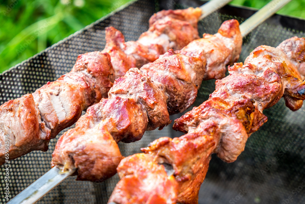 Hot shish kebab on metal skewers Hot shish kebab on metal skewers