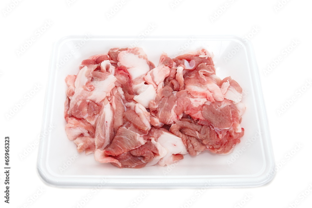 fresh red meat chopped lying in plastic tray