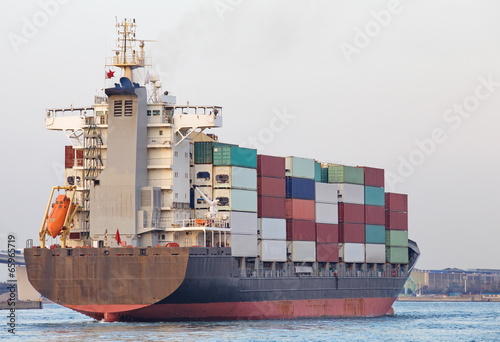 Cargo Container ship going out from sea port