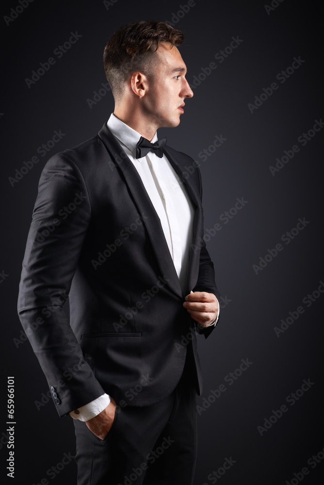 business man in suit on a dark background business man in suit on a dark background