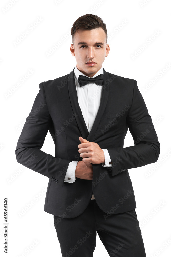 business man in a suit straightens his jacket business man in a suit straightens his jacket