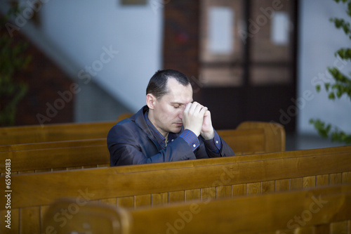 Man praying in church
