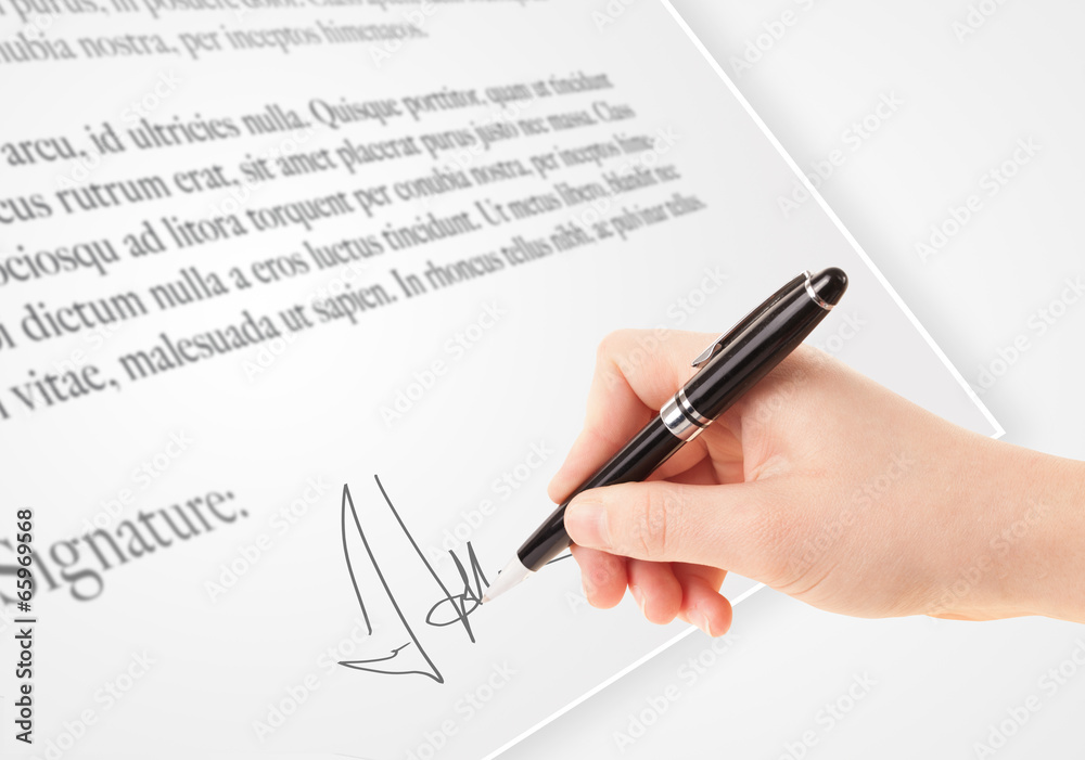 Hand writing personal signature on a paper form Hand writing personal signature on a paper form